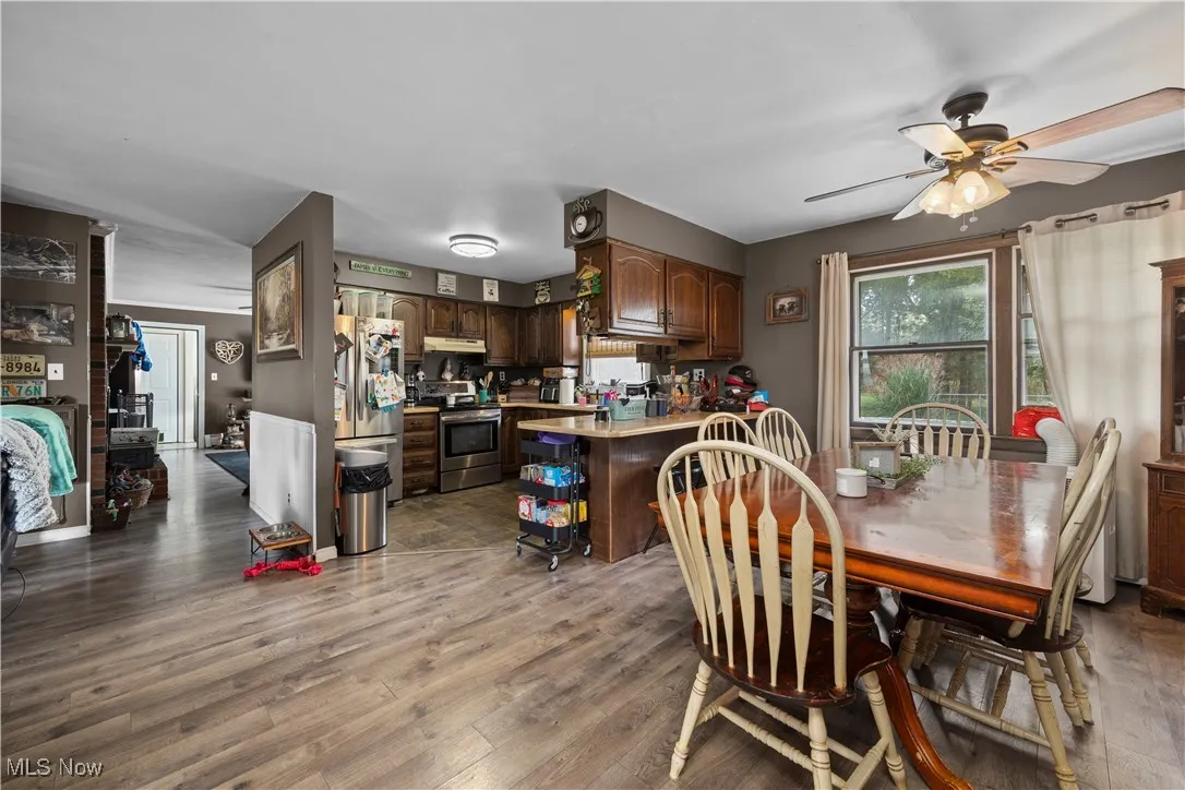 Dining room featuring light wood finished floors and ceiling fan
