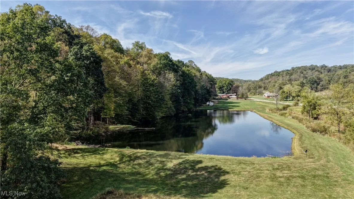 Water view featuring a heavily wooded area
