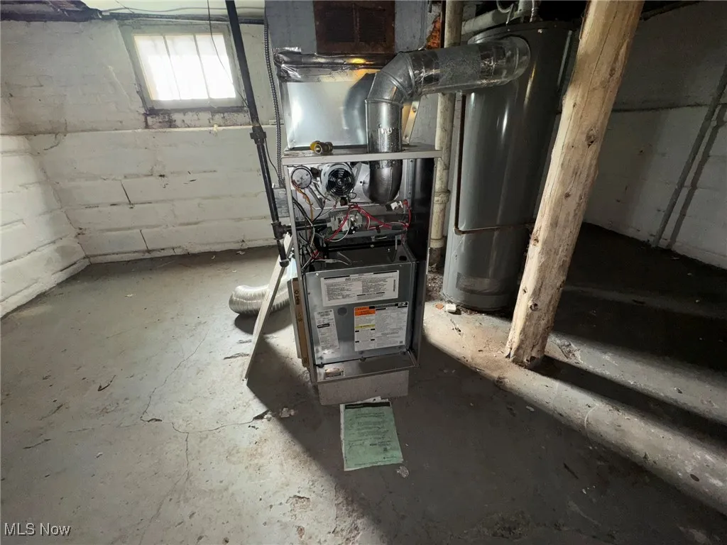 Utility room with water heater and heating unit