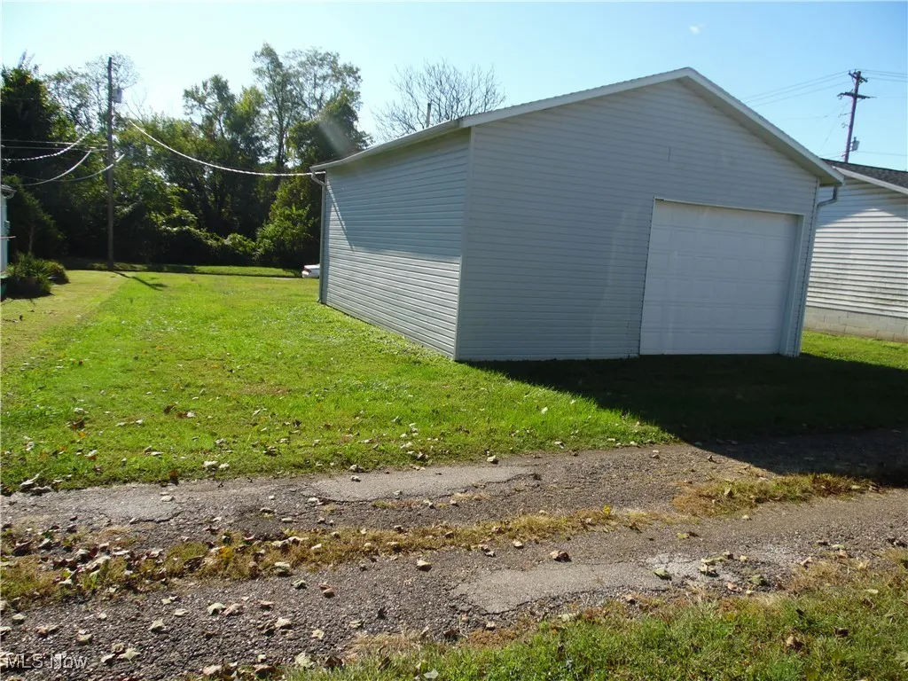 Detached garage featuring driveway