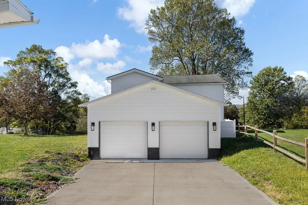 Garage with concrete driveway