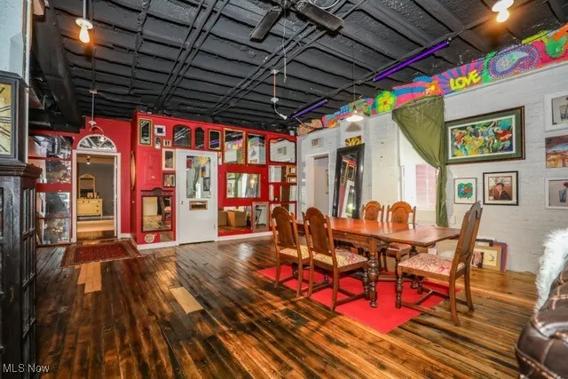 Dining room featuring dark wood-style floors