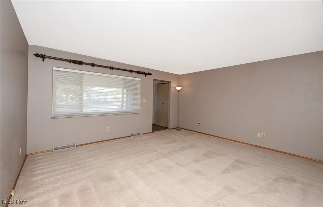 Living Room has hardwood floor under carpet