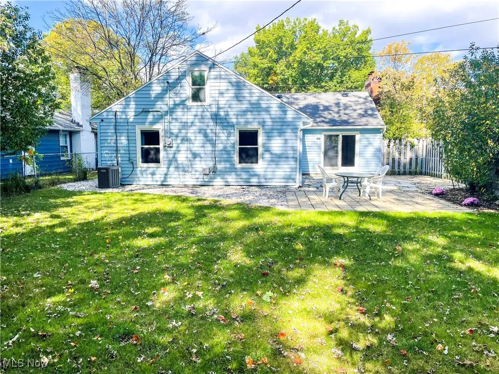 Back of property featuring a patio area and a chimney
