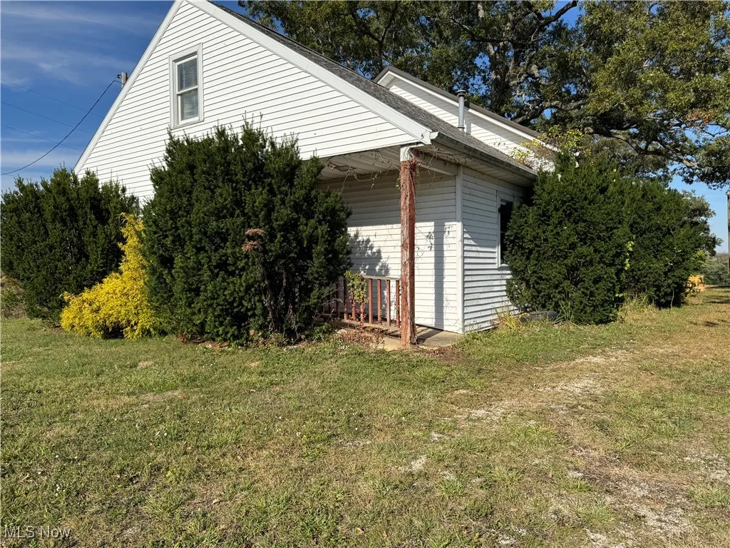 View of home's exterior with a lawn