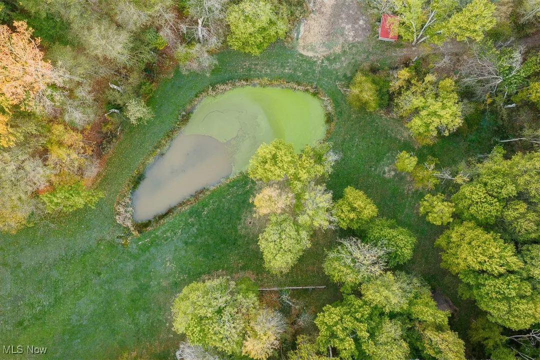Aerial overview of property's location with a nearby body of water