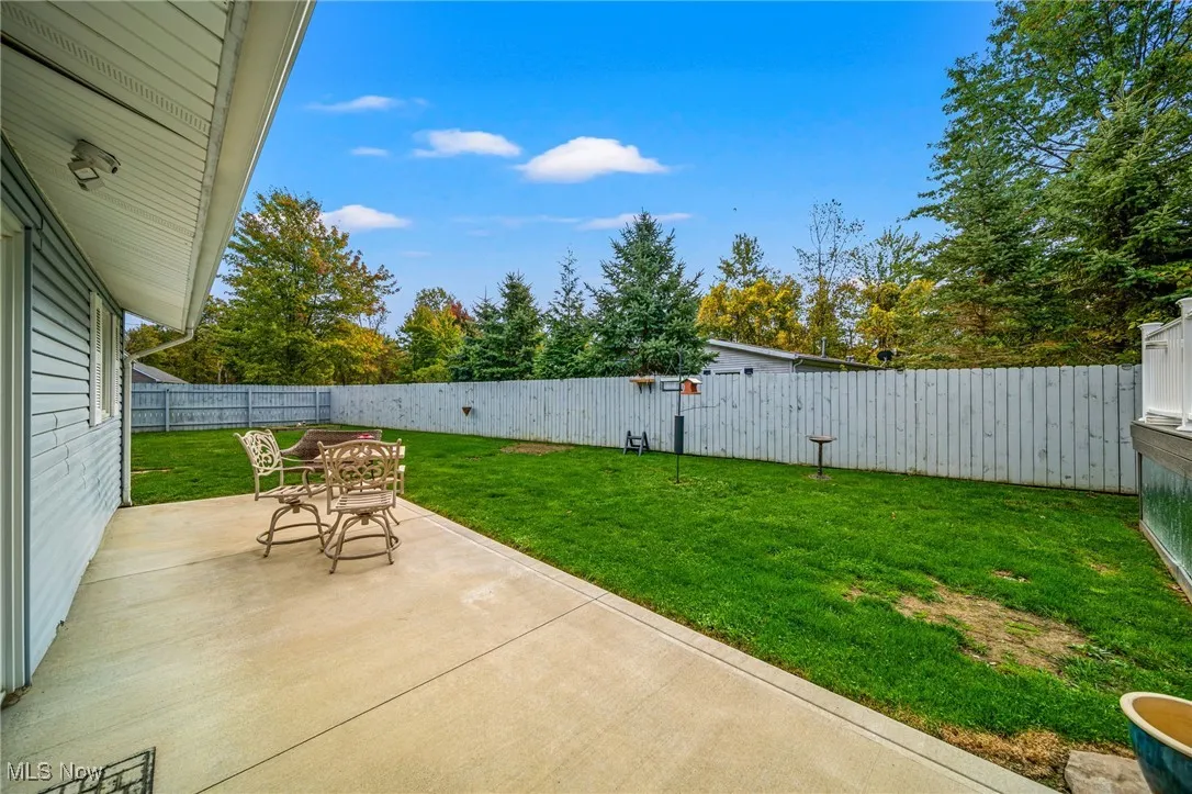 Fenced backyard featuring a patio