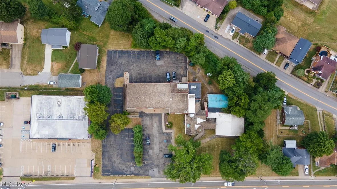 Aerial overview of property's location with nearby suburban area