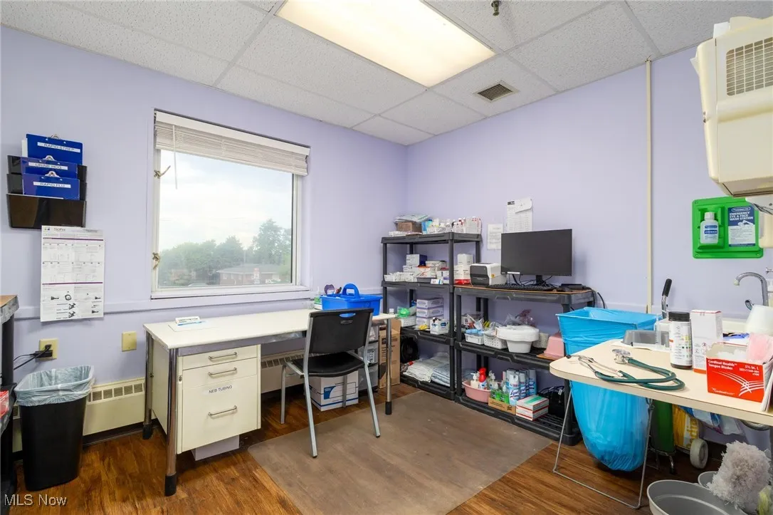 Office area featuring a paneled ceiling