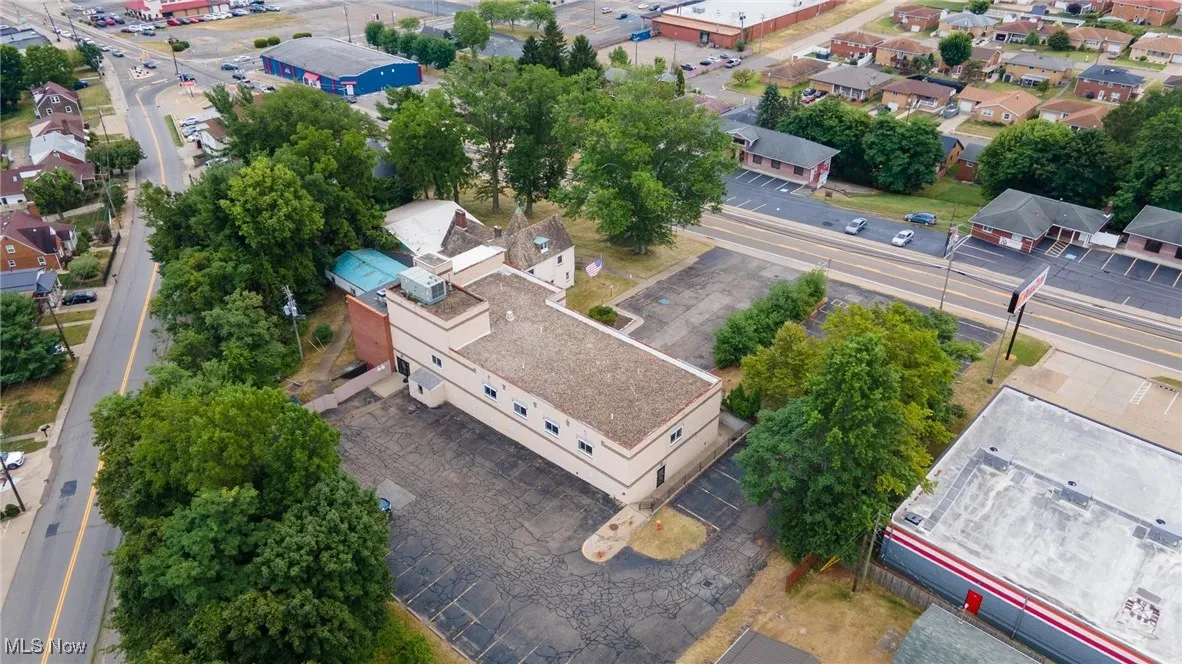 Aerial overview of property's location featuring nearby suburban area