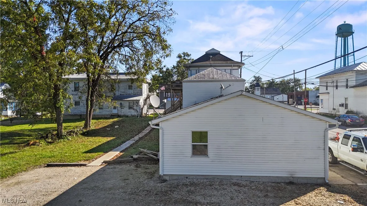 View of home's exterior with a yard