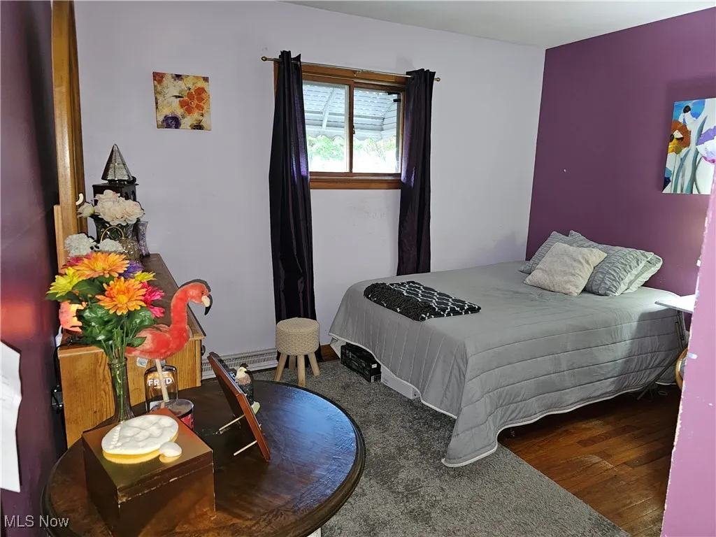 Bedroom with wood finished floors