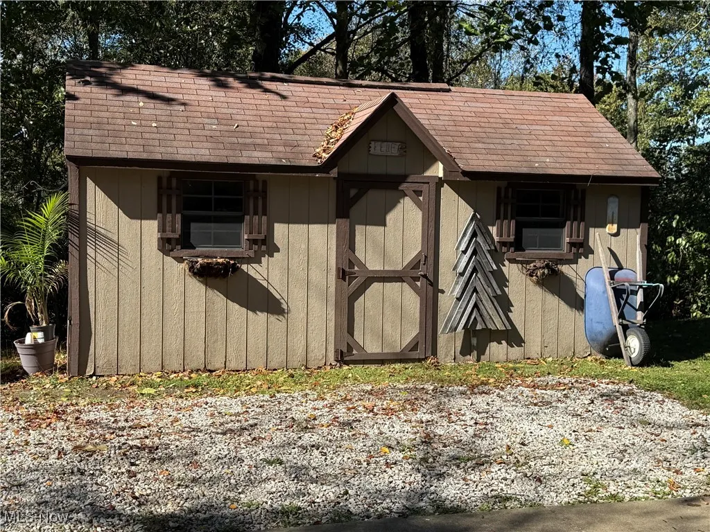 View of shed featuring oil tank