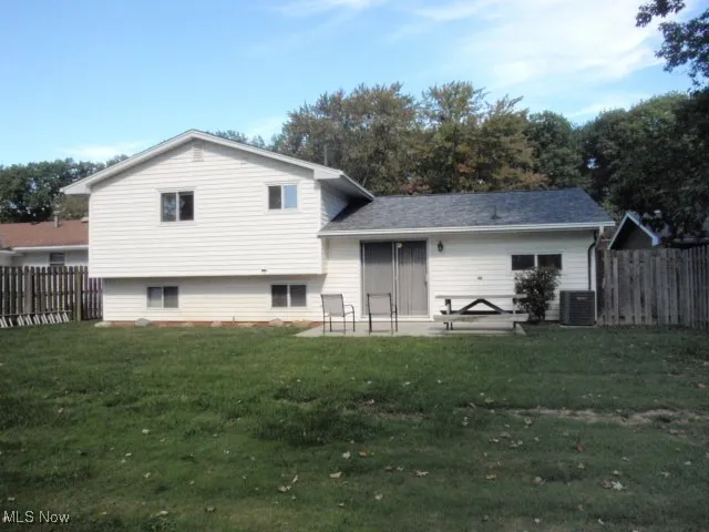 Rear view of property featuring a patio area