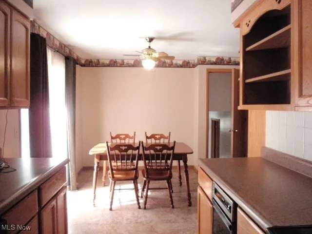 Dining space featuring a ceiling fan