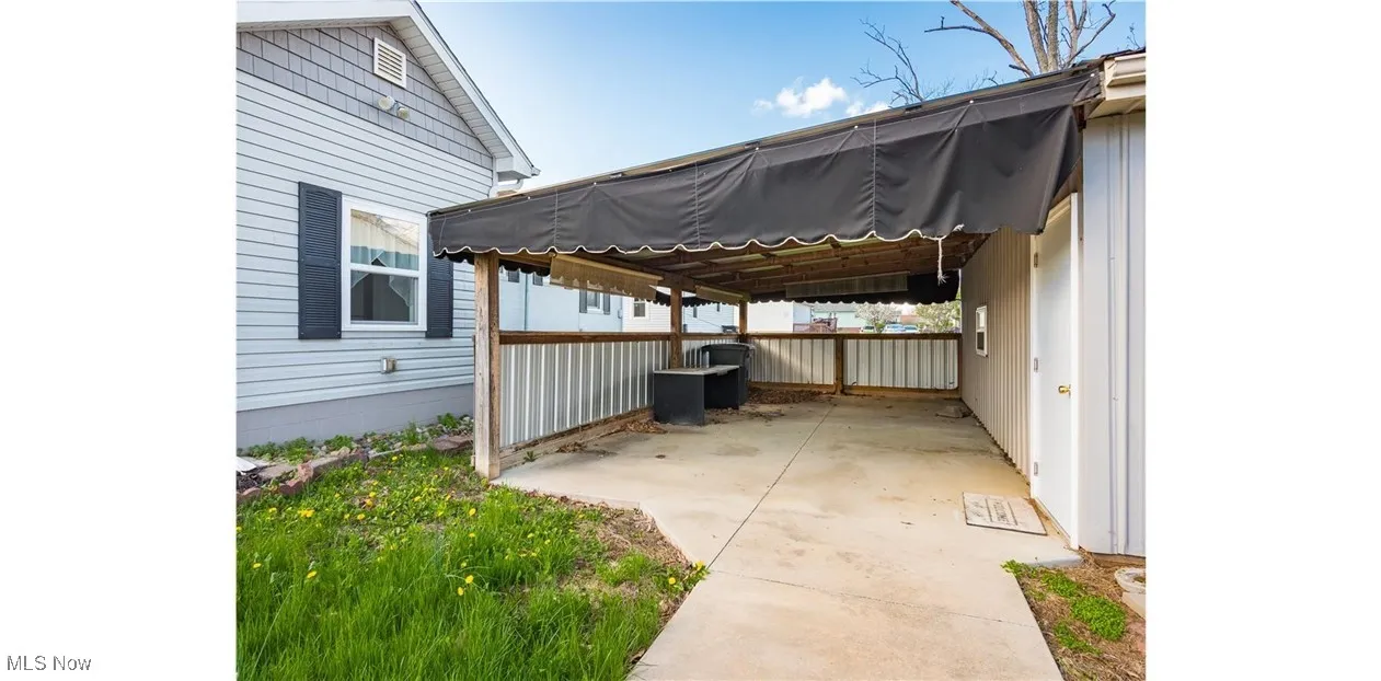 View of patio / terrace featuring a carport