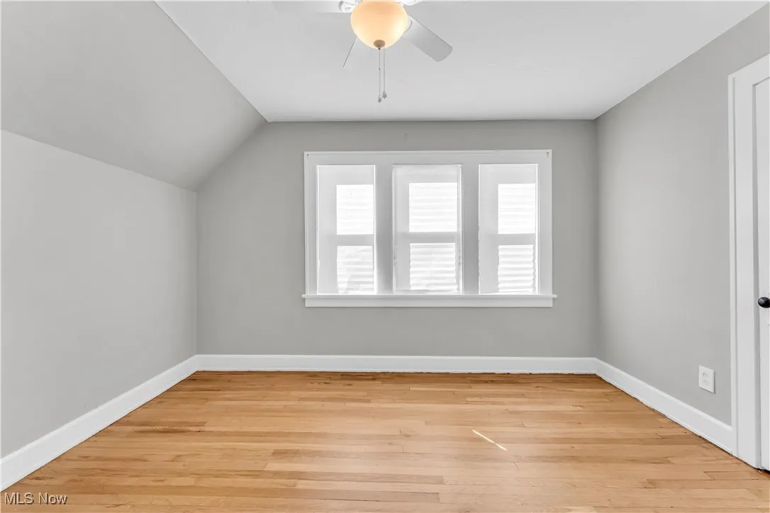 Bonus room featuring light wood-type flooring and ceiling fan