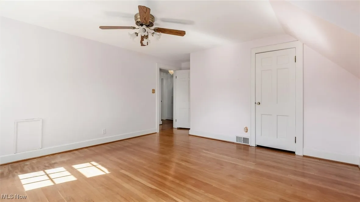 Unfurnished bedroom featuring light wood finished floors and a ceiling fan