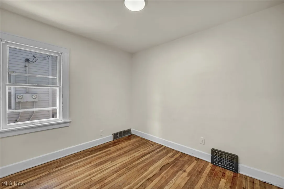 Unfurnished room with wood finished floors