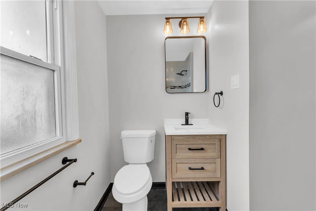 Bathroom with vanity and toilet