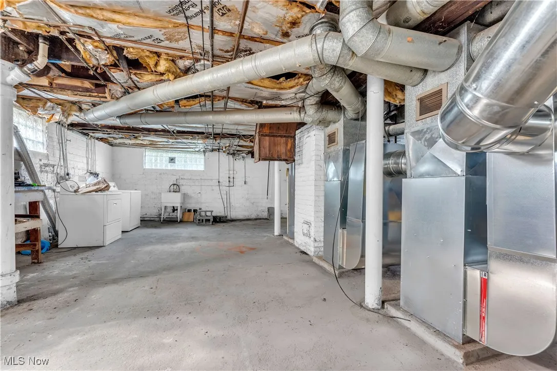 Basement with heating unit and independent washer and dryer