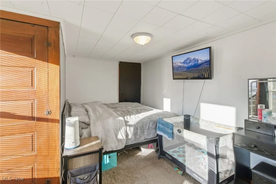Bedroom featuring carpet flooring