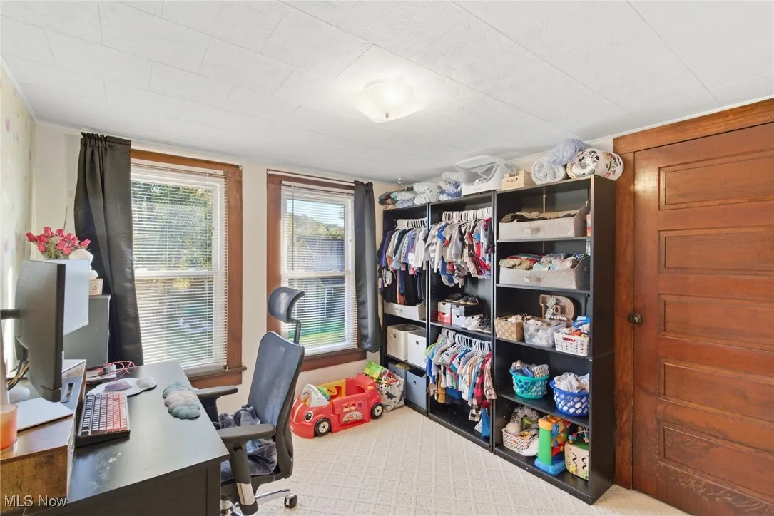 Office featuring light colored carpet