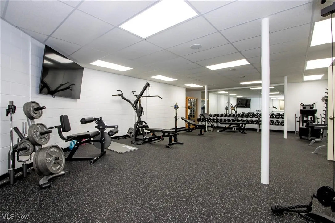 Exercise room featuring a drop ceiling