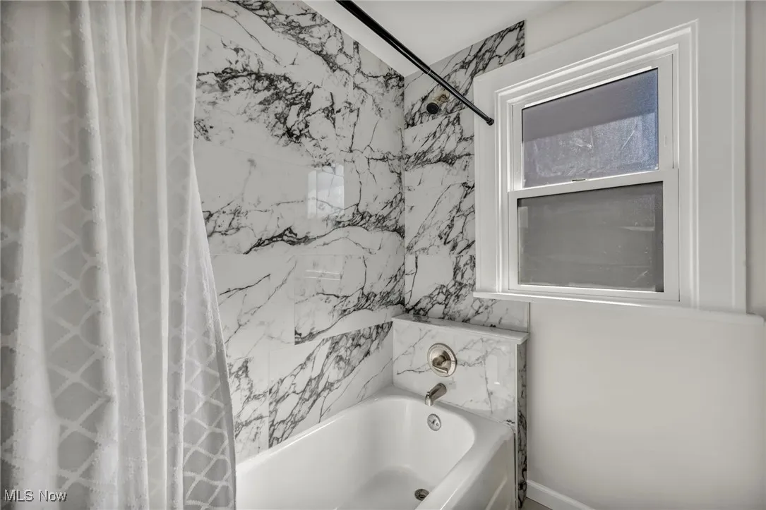 Bathroom featuring shower / bath combo