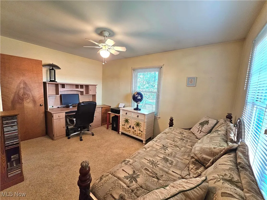 Carpeted bedroom being used as an office