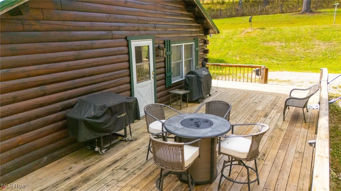 Deck with grilling area and outdoor dining space