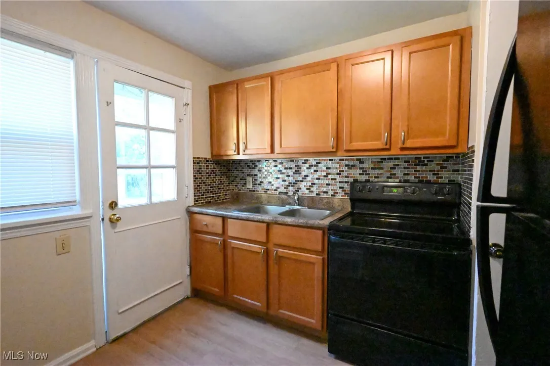 Unit 2 kitchen with stove and fridge