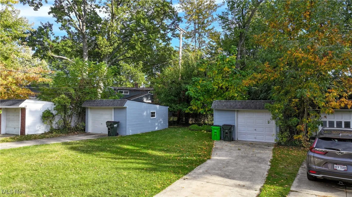 Back yard showing both garages