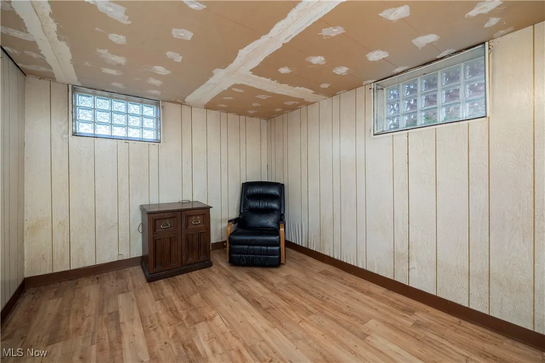 Basement bedroom featuring light wood-vinyl laminate flooring