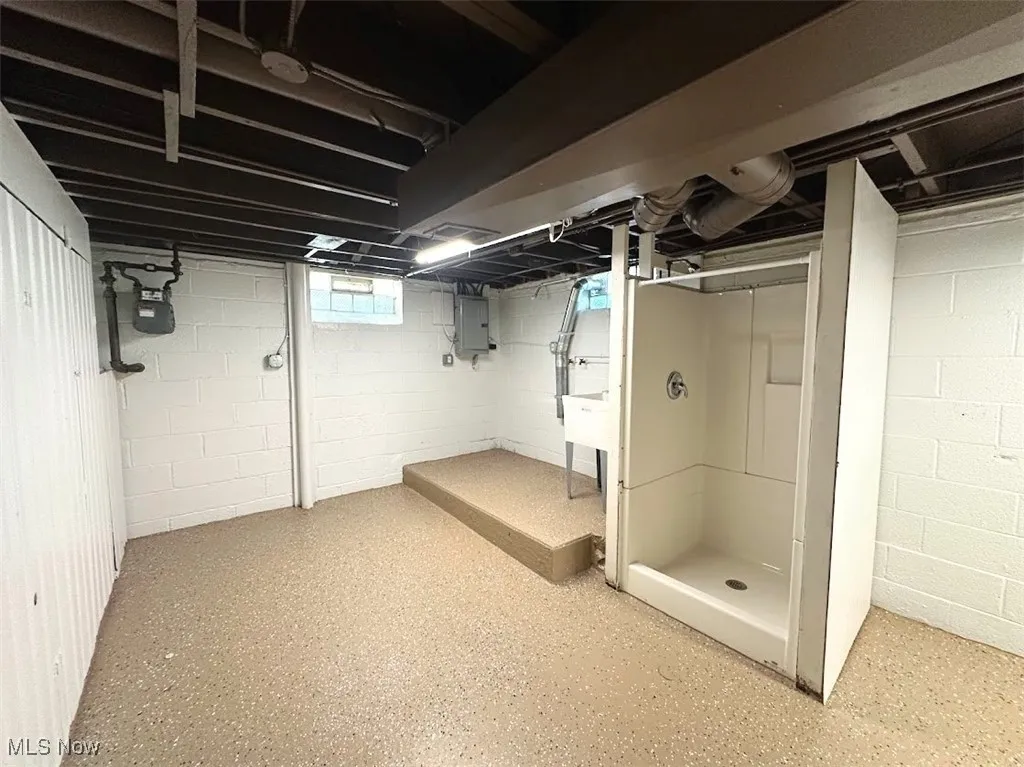 Below grade area featuring electric panel
