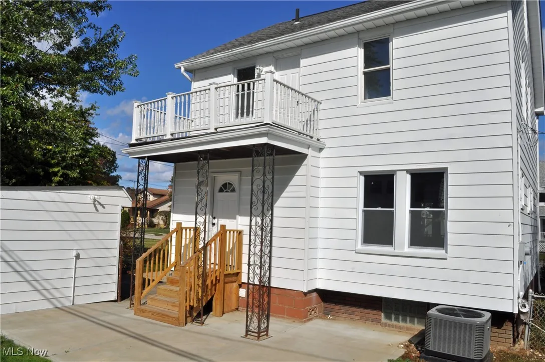 View of front of house with roof with shingles