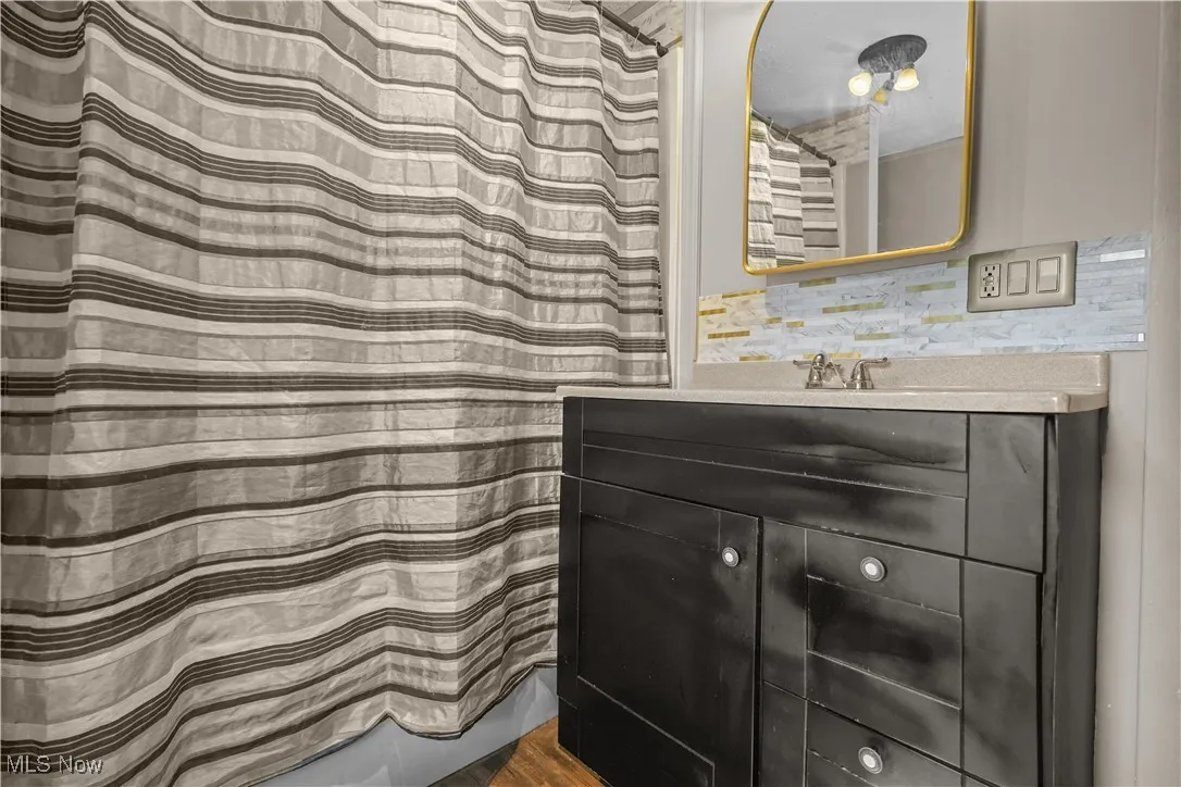 Full bathroom with vanity and shower / tub combo