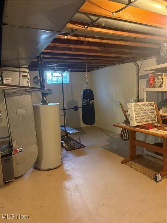 Basement with water heater and heating unit