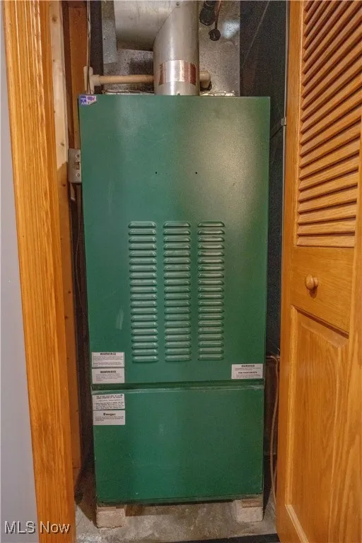 Utility room featuring a heating unit