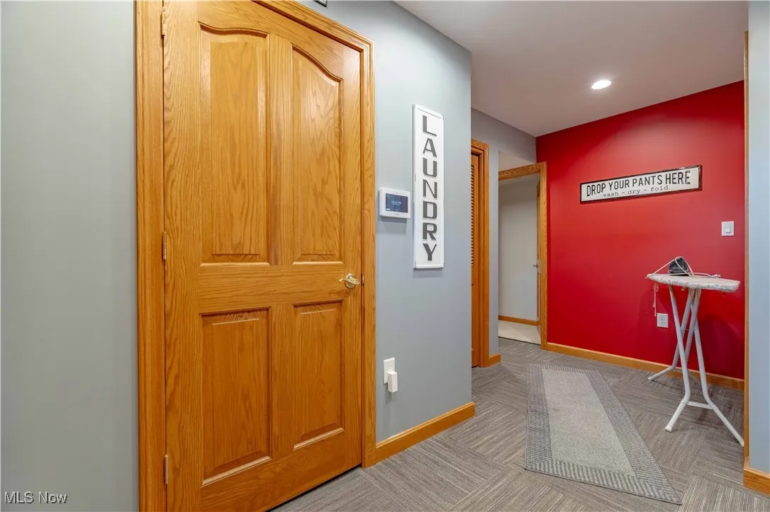 Corridor featuring carpet flooring and recessed lighting