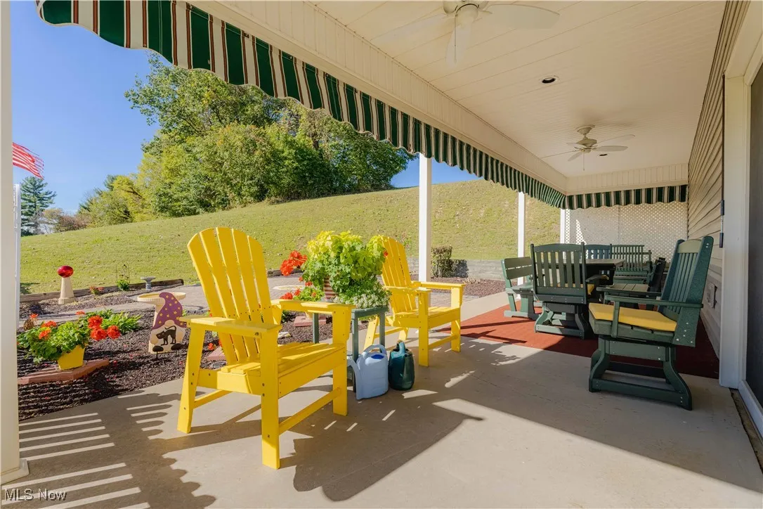 View of patio featuring ceiling fan