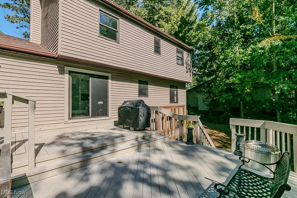 Wooden deck featuring grilling area