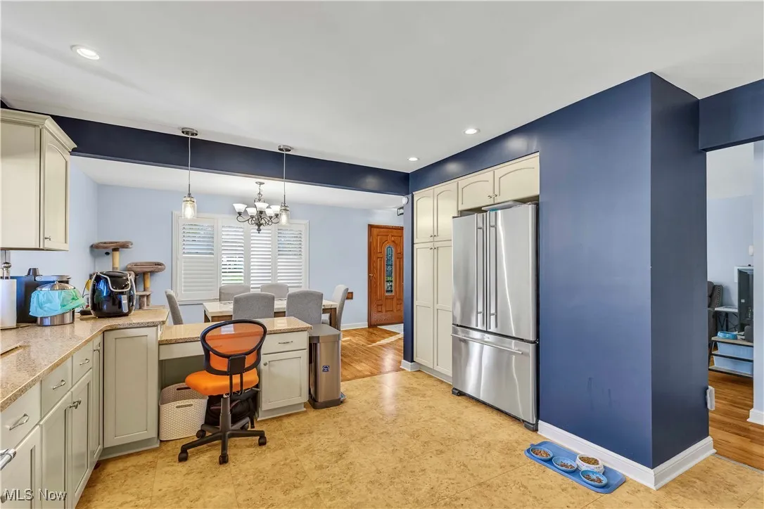 Office with recessed lighting and a chandelier