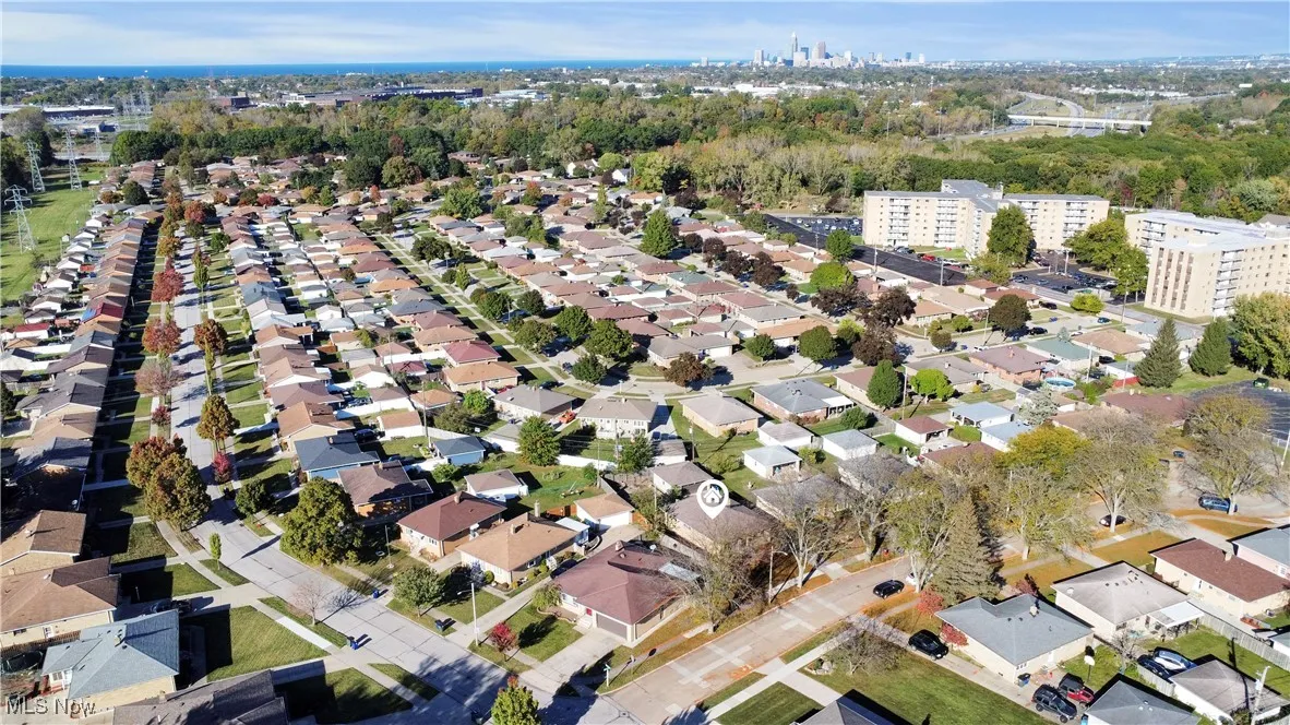 Aerial overview of property's location featuring nearby suburban area