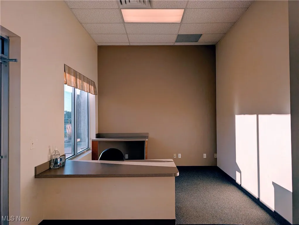 Unfurnished office featuring a paneled ceiling