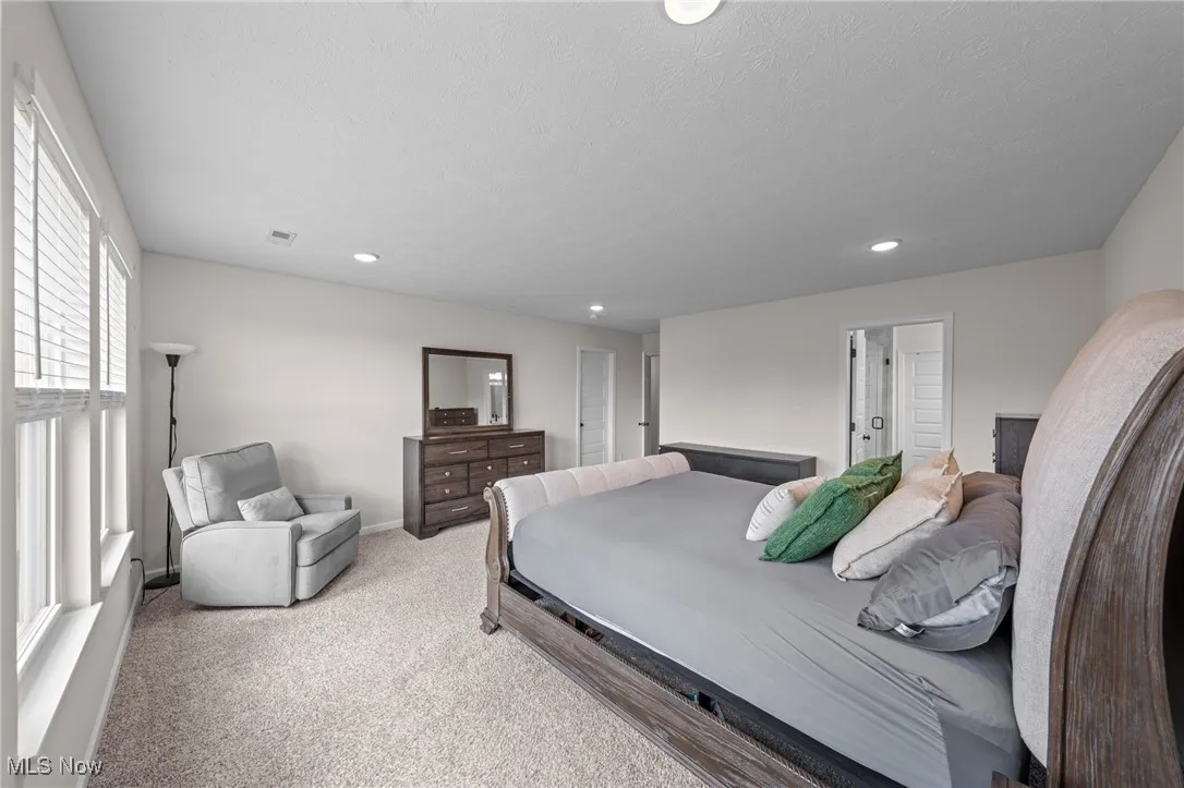 Bedroom featuring carpet and recessed lighting
