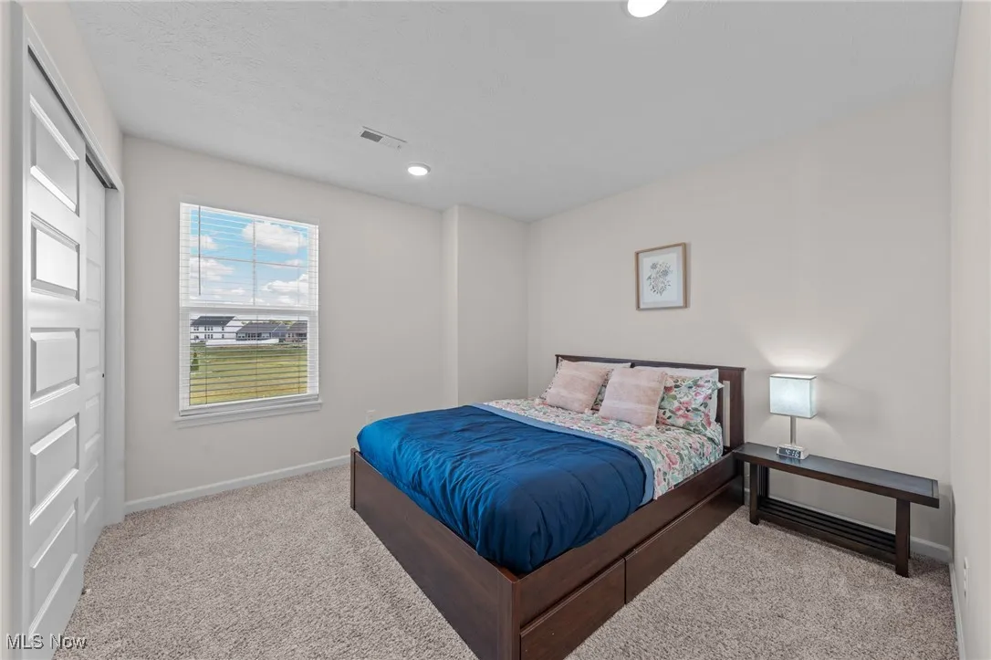 Bedroom featuring carpet flooring and recessed lighting