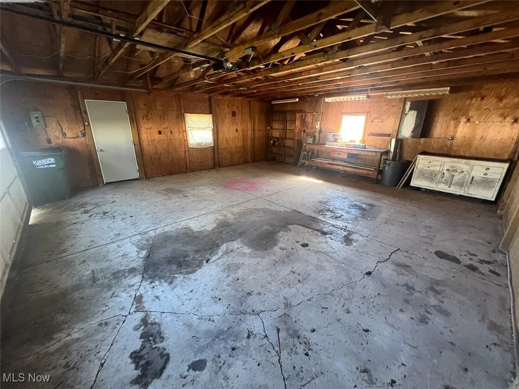 Garage featuring wood walls