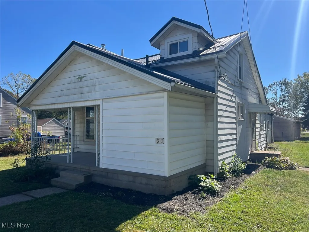 View of home's exterior featuring a yard