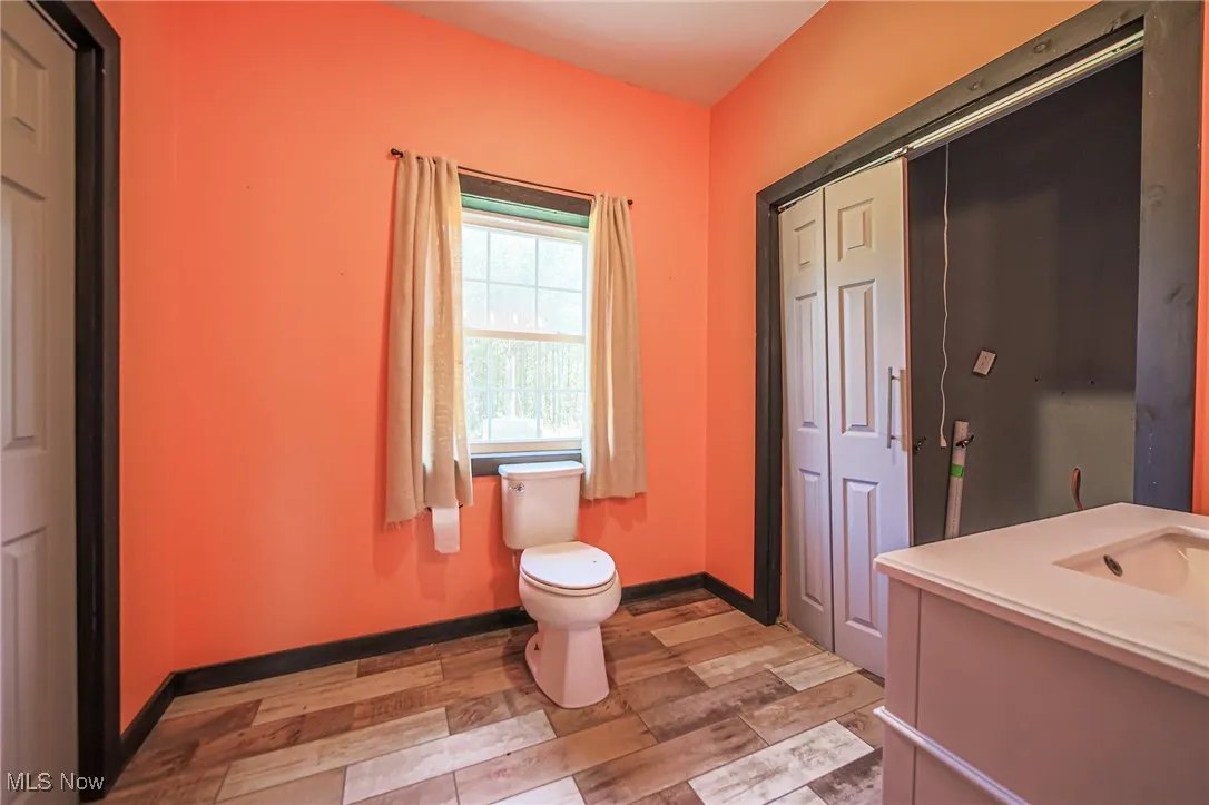 Bathroom with vanity and light wood-style floors